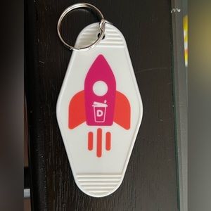 Promotional keychain from Dunkin’s rewards app, styled after vintage motel keys.